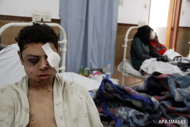 A wounded protester is being treated after being injured during clashes in Cairo's main square, Egypt, Thursday, Feb. 3, 2011. Egyptian army tanks and soldiers moved to end violence between anti-government protesters and...