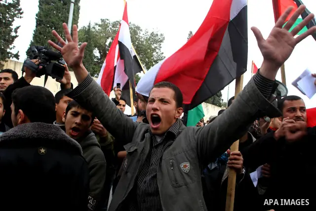 Palestinian protesters wave Egyptian flags and shout slogans during a demonstration outside the offices of the Egyptian diplomatic mission in Gaza City on February 3, 2011 in support of the anti-government protests in Eg...