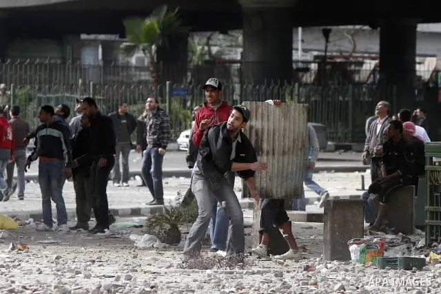 Egyptian protesters are seen in and around Tahrir square, as supporters and opponents of President Hosni Mubarak clash in some parts of the square, Cairo, capital of Egypt, Feb. 3, 2011. Egyptian army appeared to be tryi...