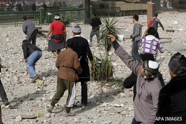 Egyptian protesters are seen in and around Tahrir square, as supporters and opponents of President Hosni Mubarak clash in some parts of the square, Cairo, capital of Egypt, Feb. 3, 2011. Egyptian army appeared to be tryi...
