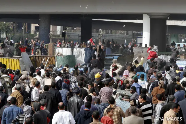 Egyptian protesters are seen in and around Tahrir square, as supporters and opponents of President Hosni Mubarak clash in some parts of the square, Cairo, capital of Egypt, Feb. 3, 2011. Egyptian army appeared to be tryi...