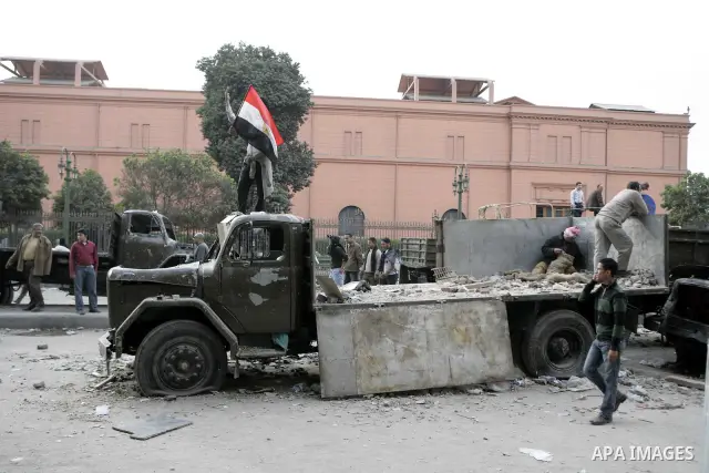Egyptian protesters are seen in and around Tahrir square, as supporters and opponents of President Hosni Mubarak clash in some parts of the square, Cairo, capital of Egypt, Feb. 3, 2011. Egyptian army appeared to be tryi...