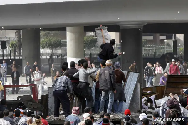 Egyptian protesters are seen in and around Tahrir square, as supporters and opponents of President Hosni Mubarak clash in some parts of the square, Cairo, capital of Egypt, Feb. 3, 2011. Egyptian army appeared to be tryi...