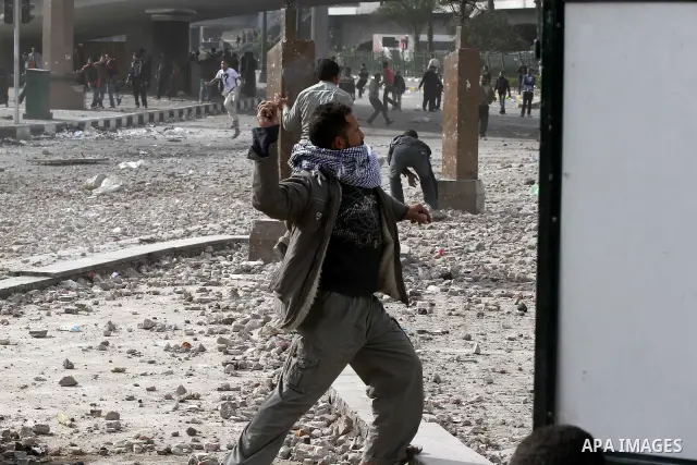 Egyptian protesters are seen in and around Tahrir square, as supporters and opponents of President Hosni Mubarak clash in some parts of the square, Cairo, capital of Egypt, Feb. 3, 2011. Egyptian army appeared to be tryi...