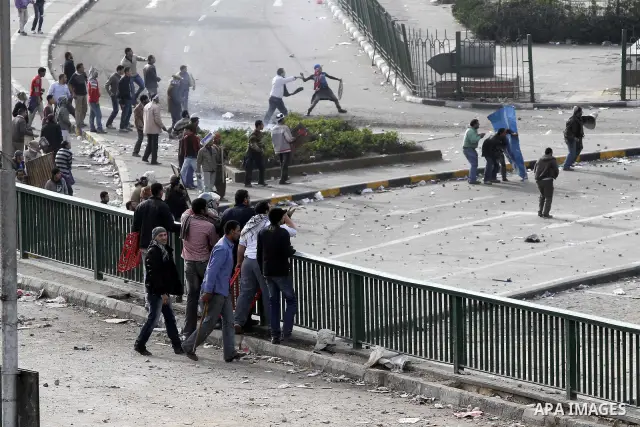 Egyptian protesters are seen in and around Tahrir square, as supporters and opponents of President Hosni Mubarak clash in some parts of the square, Cairo, capital of Egypt, Feb. 3, 2011. Egyptian army appeared to be tryi...