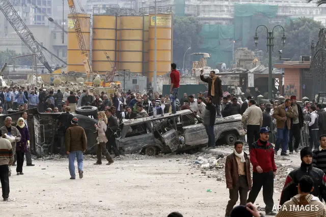 Egyptian protesters are seen in and around Tahrir square, as supporters and opponents of President Hosni Mubarak clash in some parts of the square, Cairo, capital of Egypt, Feb. 3, 2011. Egyptian army appeared to be tryi...