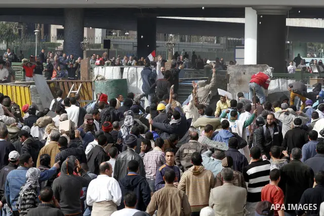 Egyptian protesters are seen in and around Tahrir square, as supporters and opponents of President Hosni Mubarak clash in some parts of the square, Cairo, capital of Egypt, Feb. 3, 2011. Egyptian army appeared to be tryi...