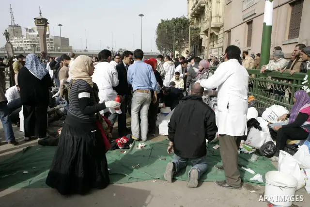 Egyptian protesters are seen in and around Tahrir square, as supporters and opponents of President Hosni Mubarak clash in some parts of the square, Cairo, capital of Egypt, Feb. 3, 2011. Egyptian army appeared to be tryi...