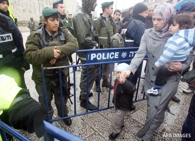 Israeli soldiers check Palestinian worrshippers aim to attend Friday prayers outside the Al Aqsa Mosque compound, also known to Jews as the Temple Mount, in Jerusalem's old city in the old city of Jerusalem on Feb. 4,201...