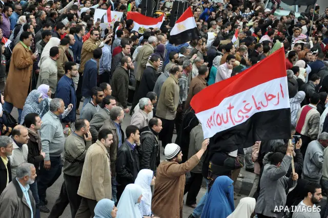 Egyptian protester shouts anti-Mubarak slogans during a protest in the Mediterranean sea city of Alexandria, Egypt, Friday, Feb. 4, 2011. Tens of thousands packed central Cairo Friday, waving flags and singing the nation...