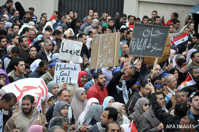 Egyptian protester shouts anti-Mubarak slogans during a protest in the Mediterranean sea city of Alexandria, Egypt, Friday, Feb. 4, 2011. Tens of thousands packed central Cairo Friday, waving flags and singing the nation...