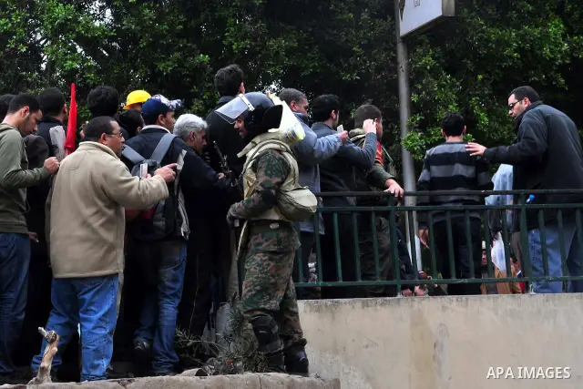 Egyptian army soldiers encircle anti-government protesters to prevent clashes with Mubarak supporters in Tahrir square in Cairo, Egypt, Saturday, Feb. 5, 2011. President Barack Obama said Egypt's Hosni Mubarak should do...