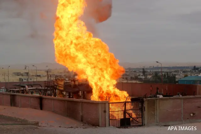 Flames are seen after an explosion went off at a gas terminal in Egypt's northern Sinai Peninsula on Saturday, Feb. 5, 2011 in El-Arish, setting off a massive fire. No injuries were reported, and the blaze was quickly br...