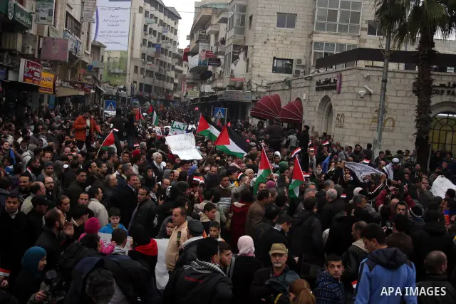 Palestinians demonstrate during a rally to show solidarity with anti-Mubarak protestors in Egypt, during a demonstration in the West Bank city of Ramallah, Saturday, Feb. 5, 2011. Photo by Issam Rimawi