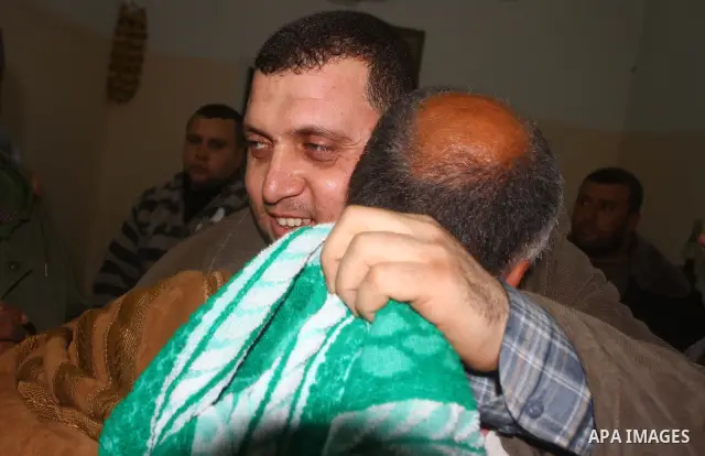 Ayman Nofal , a top Hamas armed commander, is greeted by Hamas supporters and his relatives upon his arrival to his home in Nusairat in the Central Gaza strip February 5, 2011. A senior Hamas commander returned to the Ga...