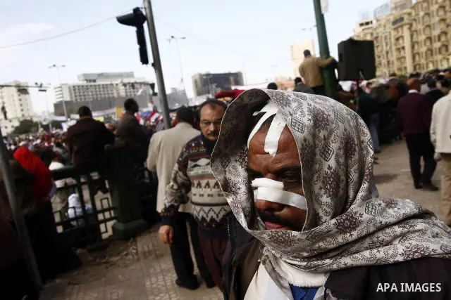 An injured opposition supporter is seen in Tahrir Square in Cairo February 6, 2011. Demonstrators camped out in Cairo's Tahrir Square, which has become an epicentre for protest, vowed to intensify their battle to oust Eg...