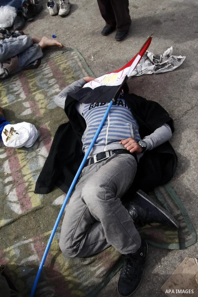 Opposition demonstrators sleep in Tahrir Square in Cairo February 6, 2011. Demonstrators camped out in Cairo's Tahrir Square, which has become an epicentre for protest, vowed to intensify their battle to oust Egypt's Pre...