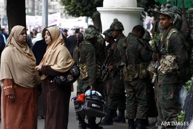 Egyptian soldiers stand guards at Tahrir Square in Cairo Feb. 6, 2011. Demonstrators camped out in Cairo's Tahrir Square, which has become an epicentre for protest, vowed to intensify their battle to oust Egypt's Preside...