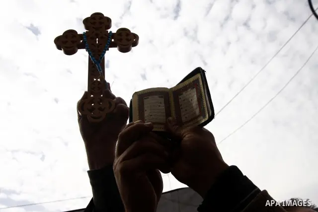 Opposition supporters hold Holy Quran and a cross in Tahrir Square in Cairo February 6, 2011. Demonstrators camped out in Cairo's Tahrir Square, which has become an epicentre for protest, vowed to intensify their battle...