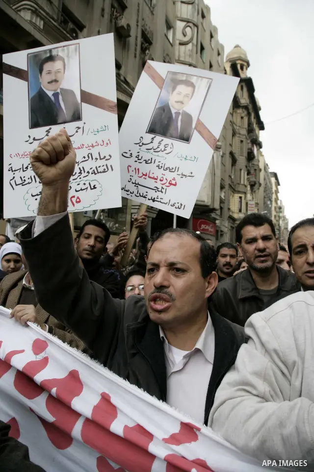 People take part in a symbolic funeral ceremony for the Egyptian journalist, Ahmed Mohammed Mahmoud in Tahrir Square, Cairo, Egypt, Monday, Feb. 7, 2011. The reporter who was shot during clashes a week ago died of his wo...