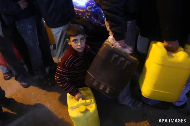 Palestinians wait to fill petrol in containers at a petrol station in Gaza city on Feb. 7, 2011. Gaza Strip residents flocked to petrol stations after clashes in neighbouring Egypt hampered smugglers ferrying fuel suppli...