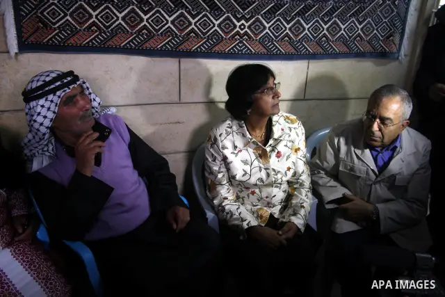 U.N. High Commissioner for Human Rights Navi Pillay and Palestinian prime minister Salam Fayyad visit the Sabri Gareeb Palestinian family home which is situated in the center of the settlement just south of Ramallah in t...