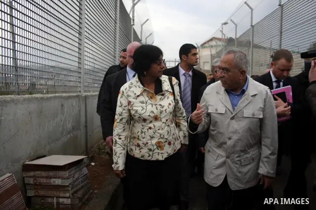 U.N. High Commissioner for Human Rights Navi Pillay and Palestinian prime minister Salam Fayyad visit the Sabri Gareeb Palestinian family home which is situated in the center of the settlement just south of Ramallah in t...