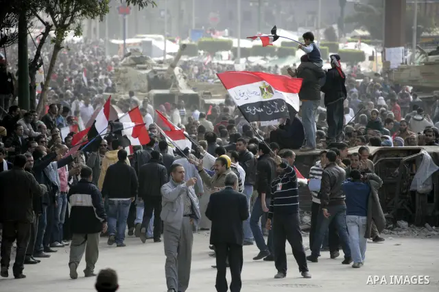 Anti-government protesters take part in demonstrations in Tahrir Square in downtown Cairo, Egypt, Tuesday, Feb. 8, 2011. Protesters appear to have settled in for a long standoff, turning Tahrir Square into a makeshift vi...