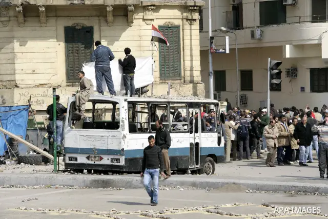 Anti-government protesters take part in demonstrations in Tahrir Square in downtown Cairo, Egypt, Tuesday, Feb. 8, 2011. Protesters appear to have settled in for a long standoff, turning Tahrir Square into a makeshift vi...