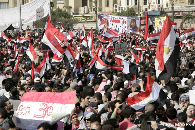 Anti-government protesters take part in demonstrations in Tahrir Square in downtown Cairo, Egypt, Tuesday, Feb. 8, 2011. Protesters appear to have settled in for a long standoff, turning Tahrir Square into a makeshift vi...