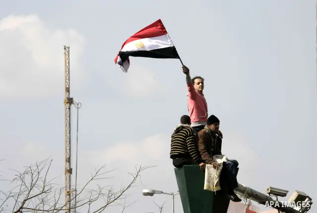 Anti-government protesters take part in demonstrations in Tahrir Square in downtown Cairo, Egypt, Tuesday, Feb. 8, 2011. Protesters appear to have settled in for a long standoff, turning Tahrir Square into a makeshift vi...