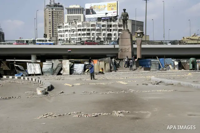 Anti-government protesters take part in demonstrations in Tahrir Square in downtown Cairo, Egypt, Tuesday, Feb. 8, 2011. Protesters appear to have settled in for a long standoff, turning Tahrir Square into a makeshift vi...