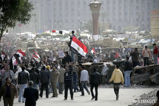 Anti-government protesters take part in demonstrations in Tahrir Square in downtown Cairo, Egypt, Tuesday, Feb. 8, 2011. Protesters appear to have settled in for a long standoff, turning Tahrir Square into a makeshift vi...