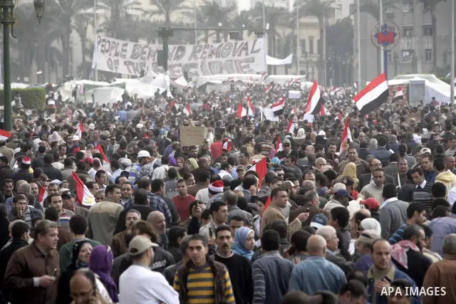 Anti-government protesters take part in demonstrations in Tahrir Square in downtown Cairo, Egypt, Tuesday, Feb. 8, 2011. Protesters appear to have settled in for a long standoff, turning Tahrir Square into a makeshift vi...