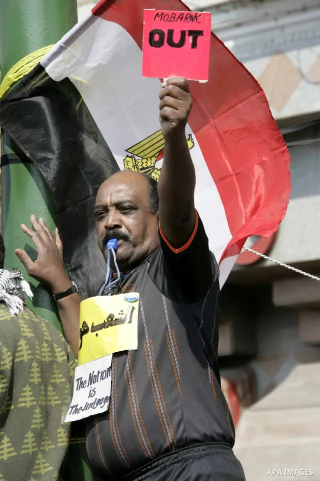 Anti-government protesters take part in demonstrations in Tahrir Square in downtown Cairo, Egypt, Tuesday, Feb. 8, 2011. Protesters appear to have settled in for a long standoff, turning Tahrir Square into a makeshift vi...