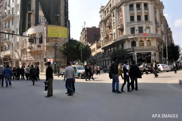 Anti-government protesters take part in demonstrations in Tahrir Square in downtown Cairo, Egypt, Tuesday, Feb. 8, 2011. Protesters appear to have settled in for a long standoff, turning Tahrir Square into a makeshift vi...