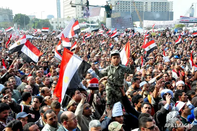 Anti-government protesters take part in demonstrations in Tahrir Square in downtown Cairo, Egypt, Tuesday, Feb. 8, 2011. Protesters appear to have settled in for a long standoff, turning Tahrir Square into a makeshift vi...