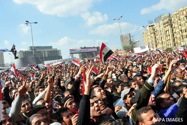 Anti-government protesters take part in demonstrations in Tahrir Square in downtown Cairo, Egypt, Tuesday, Feb. 8, 2011. Protesters appear to have settled in for a long standoff, turning Tahrir Square into a makeshift vi...