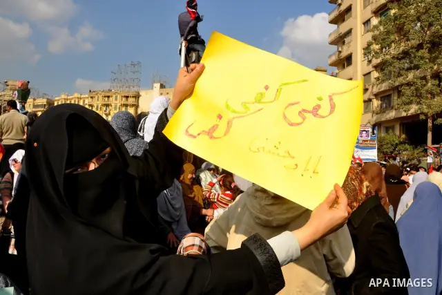 Anti-government protesters take part in demonstrations in Tahrir Square in downtown Cairo, Egypt, Tuesday, Feb. 8, 2011. Protesters appear to have settled in for a long standoff, turning Tahrir Square into a makeshift vi...