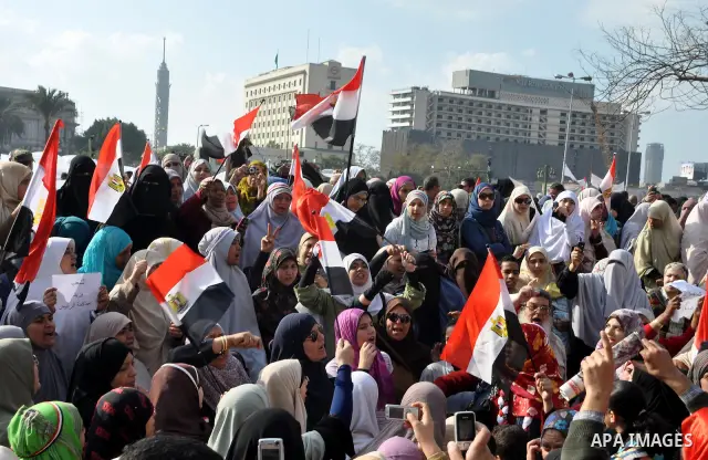 Anti-government protesters take part in demonstrations in Tahrir Square in downtown Cairo, Egypt, Tuesday, Feb. 8, 2011. Protesters appear to have settled in for a long standoff, turning Tahrir Square into a makeshift vi...