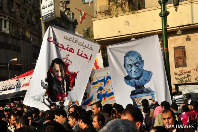 Anti-government protesters take part in demonstrations in Tahrir Square in downtown Cairo, Egypt, Tuesday, Feb. 8, 2011. Protesters appear to have settled in for a long standoff, turning Tahrir Square into a makeshift vi...