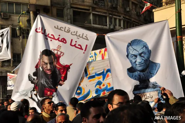 Anti-government protesters take part in demonstrations in Tahrir Square in downtown Cairo, Egypt, Tuesday, Feb. 8, 2011. Protesters appear to have settled in for a long standoff, turning Tahrir Square into a makeshift vi...