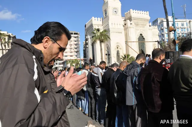 Egyptian anti government protesters pray during a demonstration in Alexandria, Egypt, on 08 February 2011, the 15th consecutive day of thousands of people protesting against Egypt's president Hosni Mubarak. Photo by Ahme...