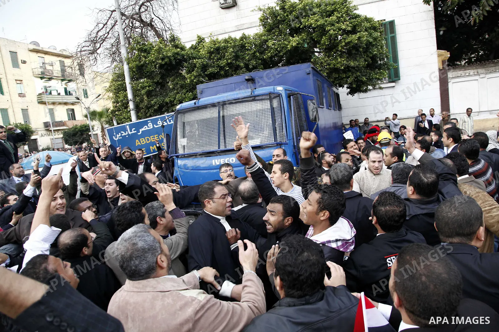 Egyptian protesters demonstrate at the gate of the presidential palace in Cairo, Egypt, Thursday, Feb. 10, 2011. Egypt's foreign minister warns of a military coup if protesters continue mass demonstrations and don't foll...