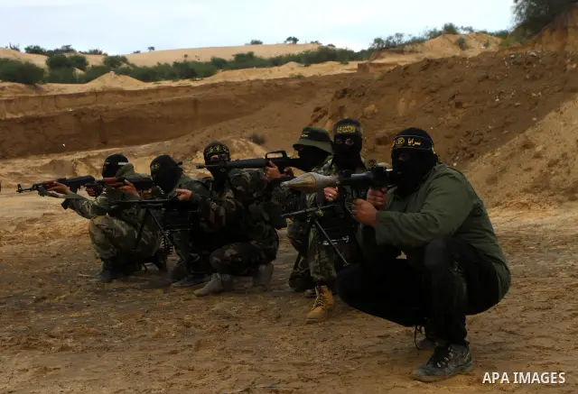 Palestinian Islamic Jihad militants participate in a training session in the outskirts of Khan Younis, southern Gaza Strip, Thursday, Feb. 10, 2011. Islamic Jihad carried out dozens of suicide bombings and other attacks...