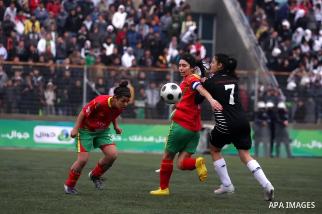 Palestinian Deyar players and Siryah Ramallah play in the opening soccer match of the Palestinian women's soccer league in the West Bank town of Aram, near Ramallah, Thursday, Feb. 10, 2011. Photo by Issam Rimawi
