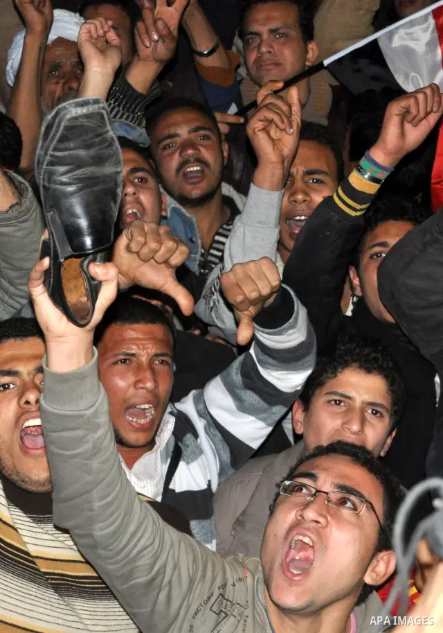 nti-government protesters hold their shoes as they react with to Egyptian President Hosni Mubarak's televised statement to his nation in Tahrir Square in downtown Cairo, Egypt Thursday, Feb. 10, 2011. Egyptian President...