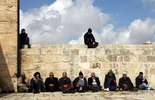 Palestinians attend Friday prayers at the Al-Aqsa Mosque compound in Jerusalem's Old City on February 11, 2011. Photo by Mahfouz Abu Turk