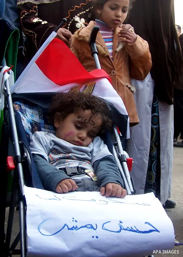 Anti-government protesters gather in front the state television building in Cairo, Egypt, Friday, Feb. 11, 2011. Mubarak has refused to step down or leave the country, and instead handed his administrative powers to his...