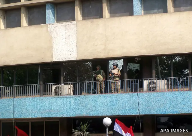 Egyptian Army soldiers stand guards at the state television building in Cairo, Egypt, Friday, Feb. 11, 2011. Mubarak has refused to step down or leave the country, and instead handed his administrative powers to his vice...